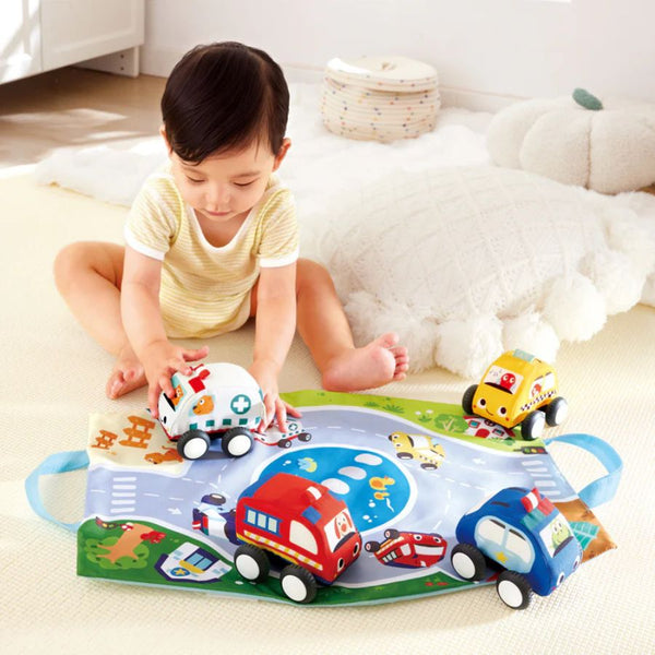 Child playing with Hape Pull-Back Plush Car Set – Soft Vehicles for Imaginative Play | KidzInc Australia
